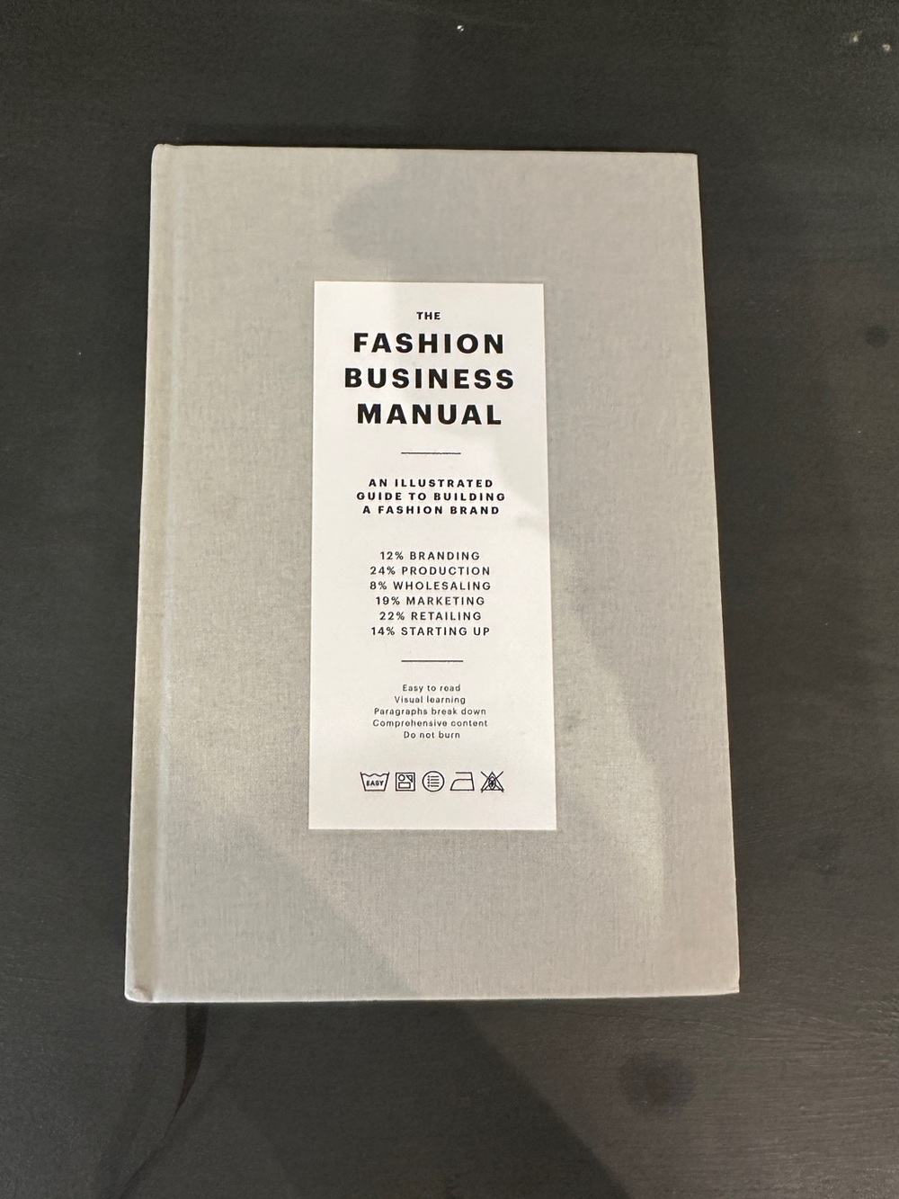 The Fashion Business Manual Hardcover in Light Gray
